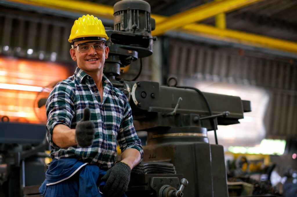front view of smart technician or engineer worker with protective helmet stand with confident Front view of smart technician or engineer worker with protective helmet stand with confident